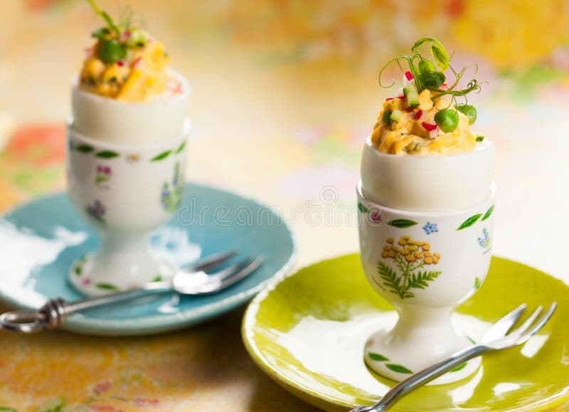 Stuffed eggs filled with cucumber,radish and green pea for Easter. Stuffed eggs filled with cucumber,radish and green pea for Easter