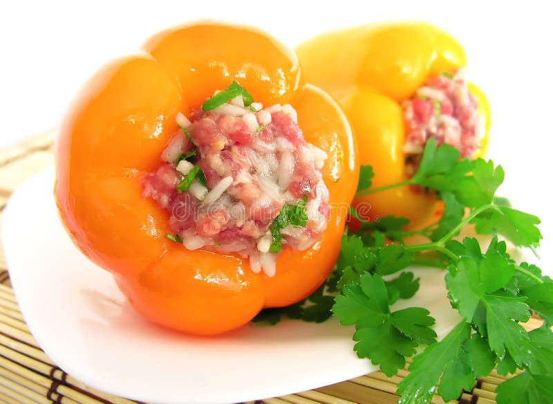 Stuffed peppers on a plate herb