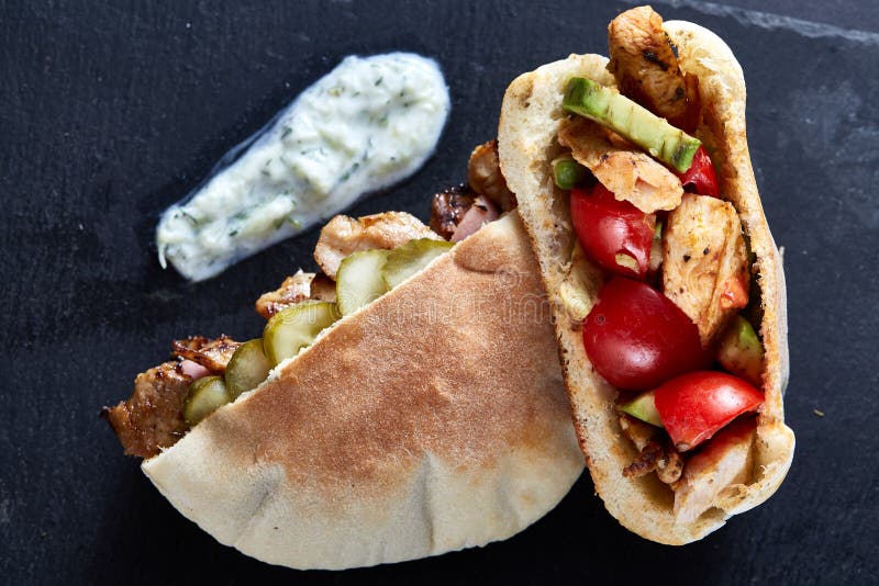 Stuffed Pita Bread with Grilled Vegetables, Pork Chops and Sauce on ...