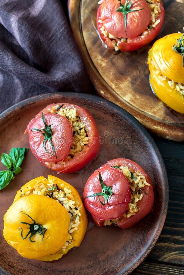 Stuffed Tomatoes with Brown Rice Stock Photo - Image of black, rustic ...