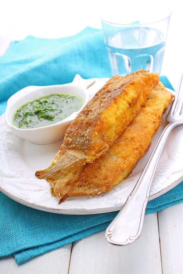 Pieces of fried fish coated in cornmeal. Pieces of fried fish coated in cornmeal