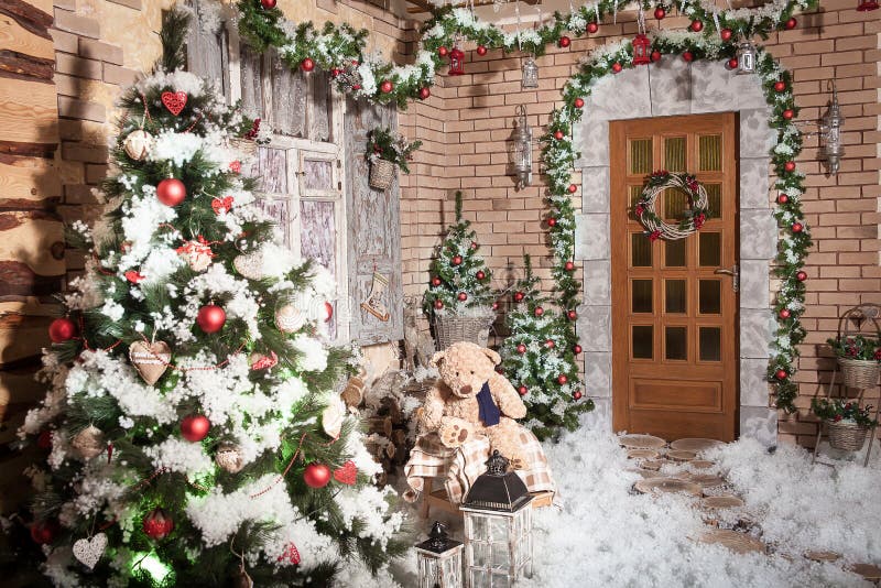 Stumps path leading to the door of winter house with Christmas wreath