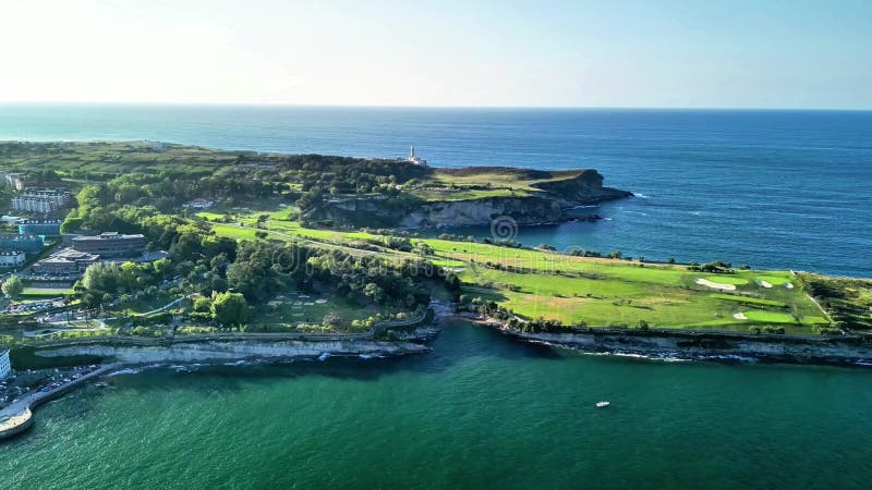 A stunning aerial view of a coastal golf course with a serene ocean backdrop and a picturesque lighthouse. Lighthouse viewpoint stock images, royalty-free photos and pictures