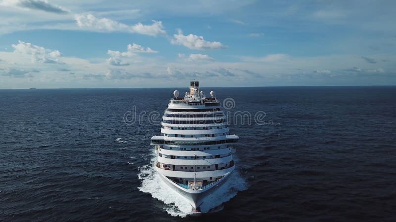 Stunning aerial view of the cruise ship in open water, front view. Stock. Front part of an anchored ocean liner sailing