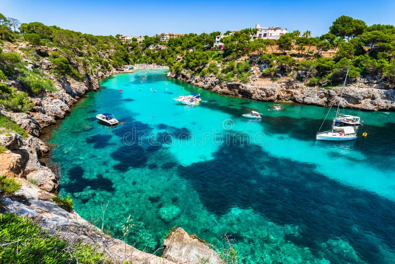 Picturesque island scenery, idyllic bay with boats at the beach Cala Pi on Mallorca, Spain Mediterranean Sea, Balearic Islands. Picturesque island scenery, idyllic bay with boats at the beach Cala Pi on Mallorca, Spain Mediterranean Sea, Balearic Islands.