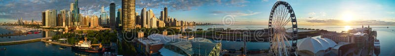 Stunning panorama of Chicago Navy Pier at sunrise with ferris wheel and city skyline