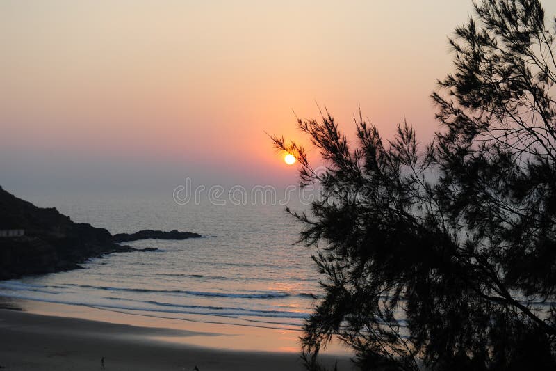 Stunning view of the ocean bay in the light of setting sun. Sunset over a beautiful sea lagoon. Seascape with copy space. stock photography Stunning view of the ocean bay in the light of setting sun. Sunset over a beautiful sea lagoon. Seascape with copy space. stock photography