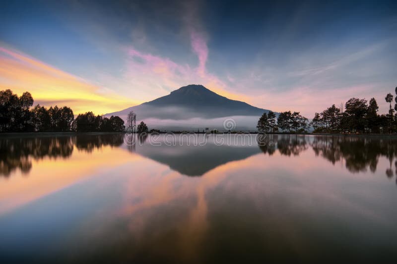 Stunning water motion a huge mountain reflection at sunrise on the lake