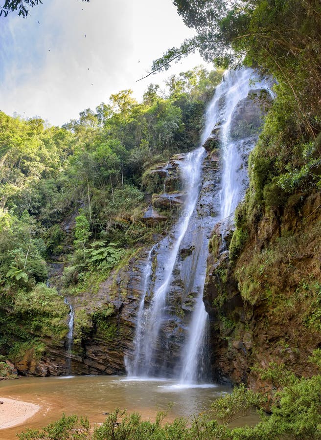 Stunning waterfall among the dense vegetation stock photography