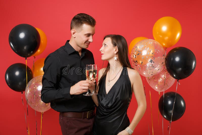 Hugging and enjoying couple. Man and princess in pink dress on background  balloons and castle. Happy joyful family. Love. Concept of birthday  celebration. - Stock Image - Everypixel