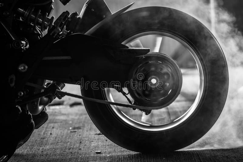 stunt rider ride and burn wheel tire