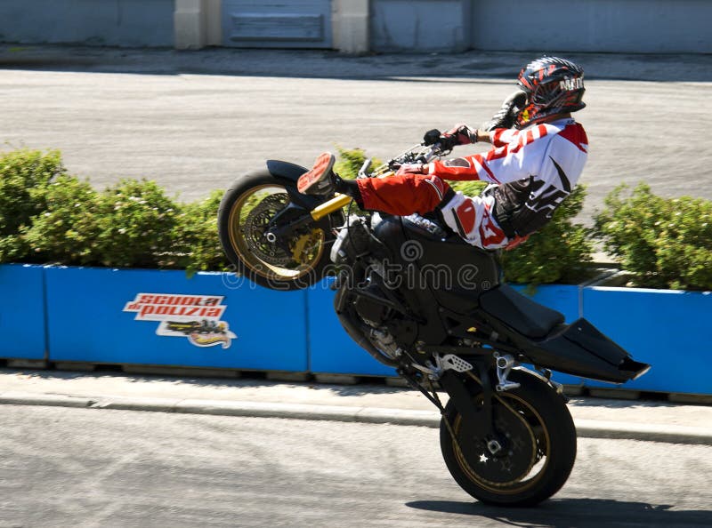 Stuntman on a motorcycle stock photo. Image of holiday - 112321476