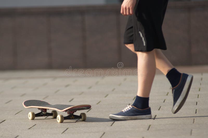 Stunts on a skateboard in the street sunny day