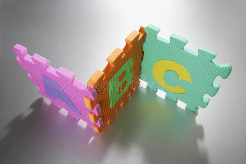 Stuoia di puzzle di alfabeto della schiuma fotografia stock libera da diritti