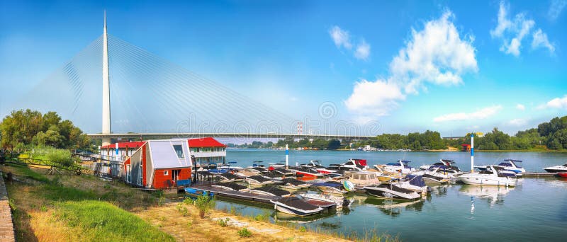 Amazing view of Ada Bridge or alternatively Sava Bridge - a cable-stayed bridge over the Sava river. Location: Belgrade, Serbia, Europe. Amazing view of Ada Bridge or alternatively Sava Bridge - a cable-stayed bridge over the Sava river. Location: Belgrade, Serbia, Europe