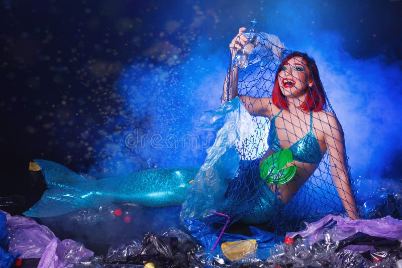 Stupid Fairytale Mermaid in Polluted Ocean. Plastic Trash and Garbage