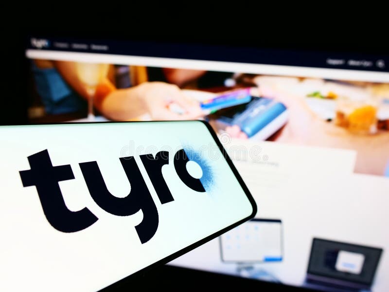 Cellphone with logo of Australian fintech company Tyro Payments Limited on screen in front of business website.