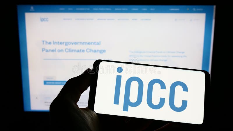 Person holding smartphone with logo of Intergovernmental Panel on Climate Change (IPCC) on screen in front of website. royalty free stock photos