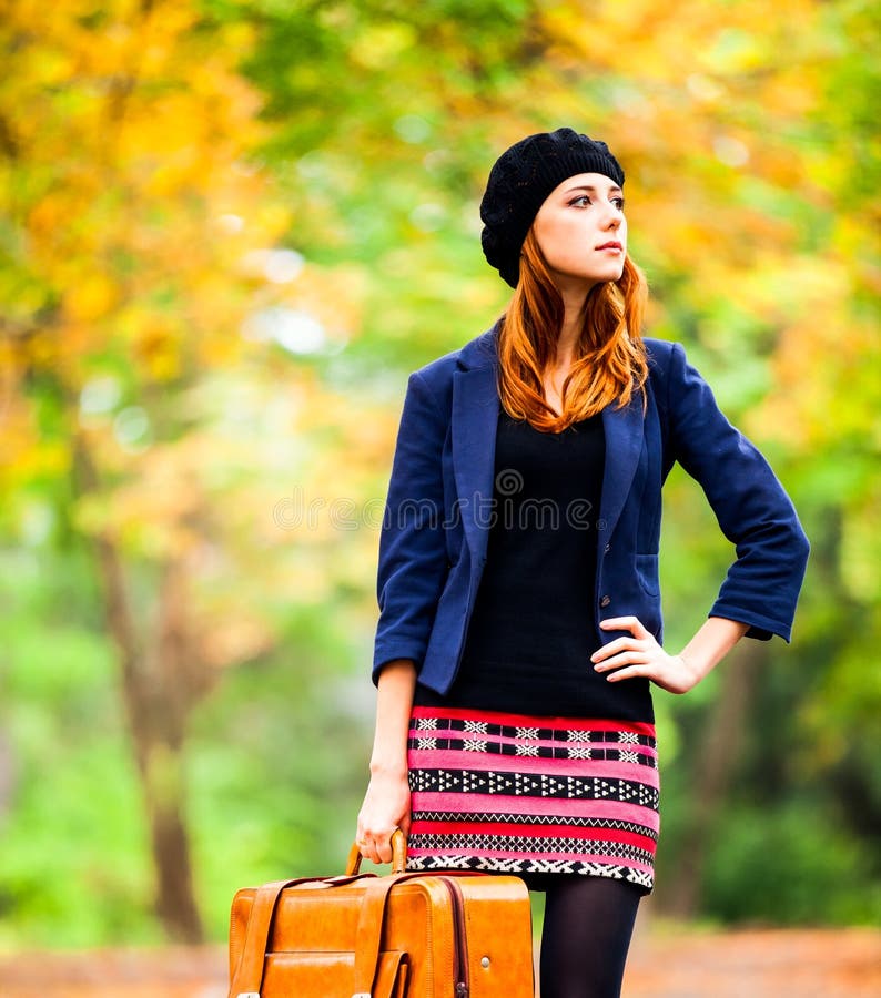 Style redhead girl in beret, jacket and skirt with suitcase royalty free stock photos Style redhead girl in beret, jacket and skirt with suitcase royalty free stock photos