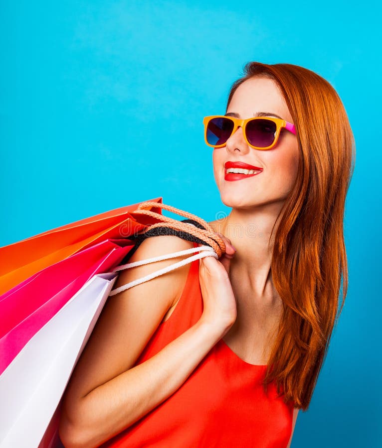 Style Redhead Woman Holding Shopping Bags Stock Photo - Image of ...