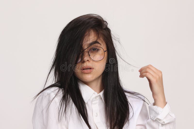 Beautiful Caucasian Hipster Girl with Black Hair and Glasses is Posing in Studio on Isolated Background. Style, Trends, Fashion Stock Photo Image of face: 181443482