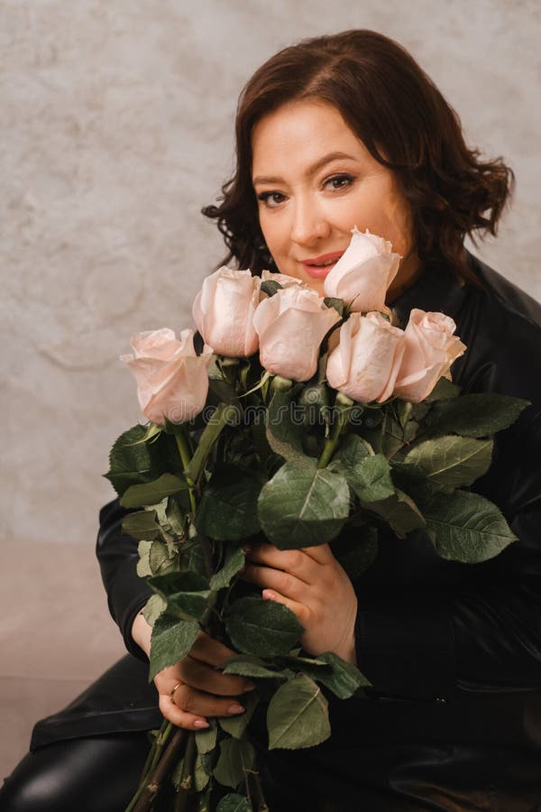 A Stylish Adult Woman In Black Leather Clothes Stands With A Bouquet Of women-dressed-in-stylish-trendy-clothes-female-fashion-illustration