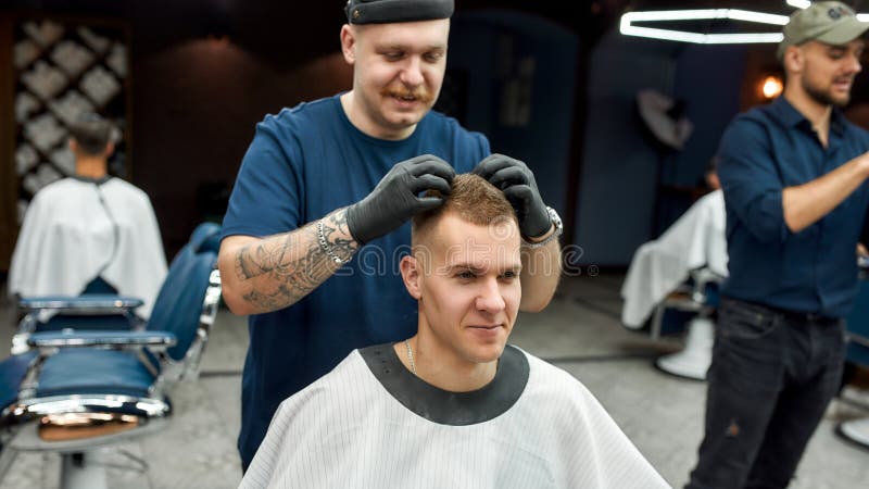 Great Job. Stylish Barber with Tattoo on Hand Making Hair Styling for Young  Handsome Guy Sitting in Barber Shop Chair Stock Image - Image of client,  fashionable: 184118001