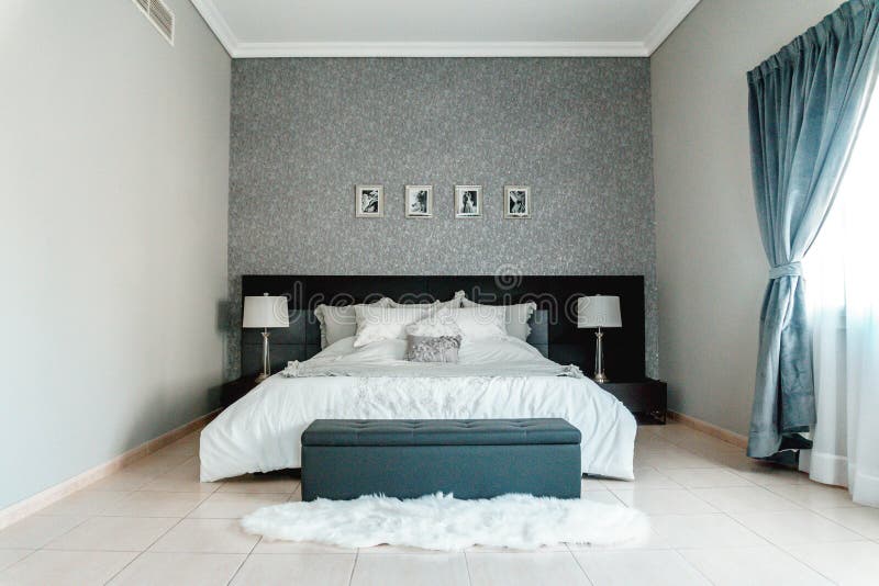 Stylish Bedroom Interior with Bed and Lamps in Doha Qatar Editorial