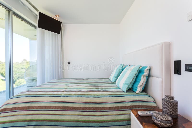 Stylish bedroom in a modern house. For family. royalty free stock photo