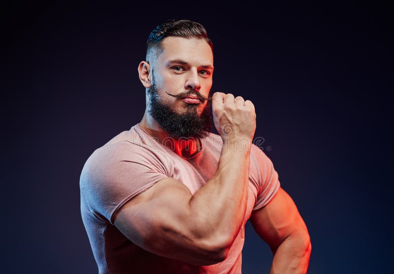 Stylish Bodybuilder Touches His Mustache and Posing Stock Photo - Image of  muscular, macho: 197041380