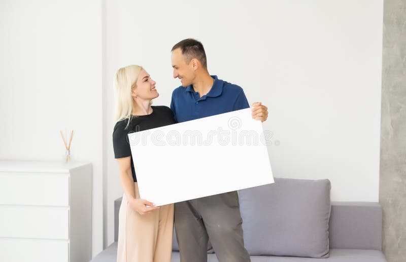 Stylish Couple Holding a Photo Canvas Stock Photo Image of business