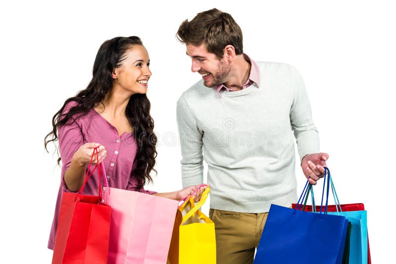 Stylish couple holding shopping bags stock images Stylish couple holding shopping bags stock images