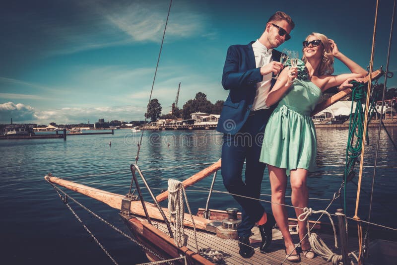 Stylish couple on a luxury yacht