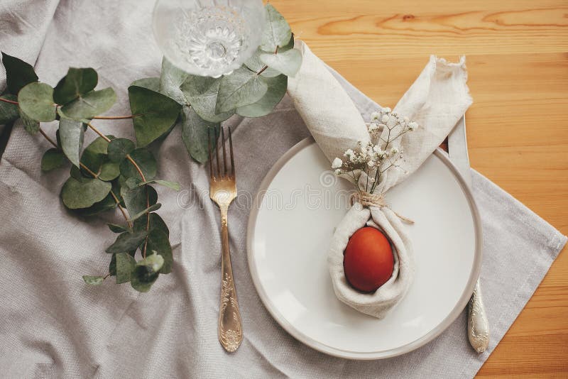 Stylish Easter Brunch Table Setting with Egg in Easter Bunny Napkin on