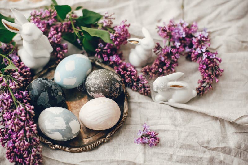 Stylish Easter Eggs on Vintage Plate, White Bunnies and Lilac Flowers ...