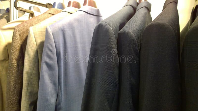 https://thumbs.dreamstime.com/b/stylish-expensive-men-s-business-suits-sale-clothes-hangers-fashion-managers-businessmen-concept-premium-store-193337025.jpg