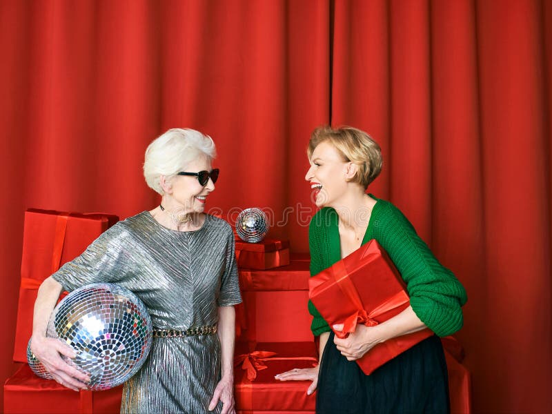 Stylish and Fancy Senior and Mature Woman at the Party with Gift