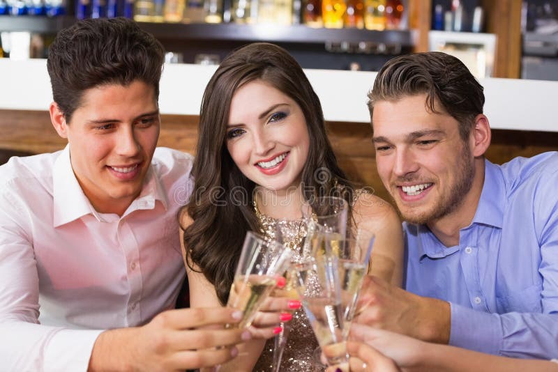 Stylish friends having a drink together