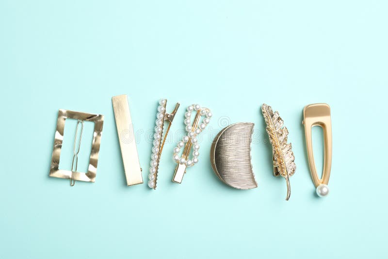 Stylish Hair Clips on Light Blue Background, Flat Lay Stock Image