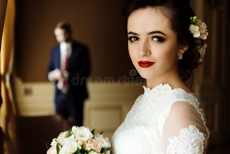 Stylish luxury bride and handsome elegant groom on the backgrou royalty free stock images