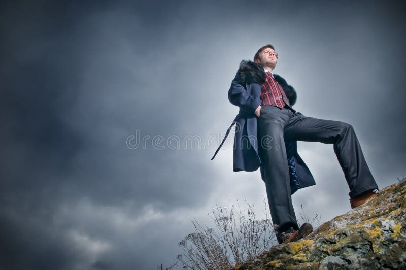 Stylish man over sky background