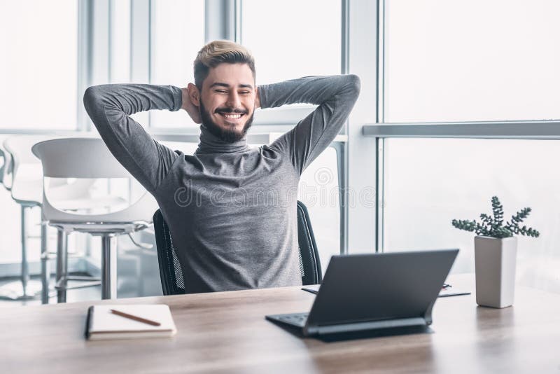 Stylish man working taking a break in modern office stock photos Stylish man working taking a break in modern office stock photos