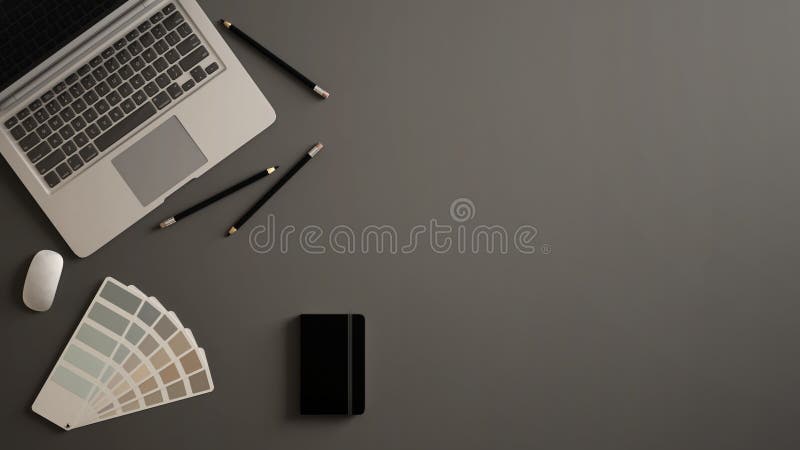 Stylish minimal office table desk. Workspace with laptop, notebook, pencils and sample color palette on gray background. Flat lay