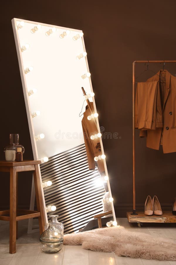 Stylish Mirror with Light Bulbs in Dressing Room. Interior Design Stock