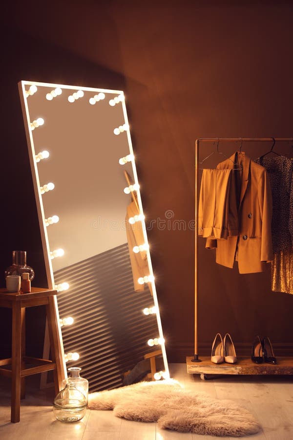 Stylish Mirror with Light Bulbs in Dressing Room. Interior Design Stock
