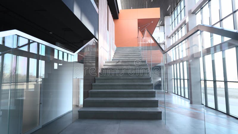 Stylish and modern office building lobby interior. Large panoramic windows and stairs with transparent railings