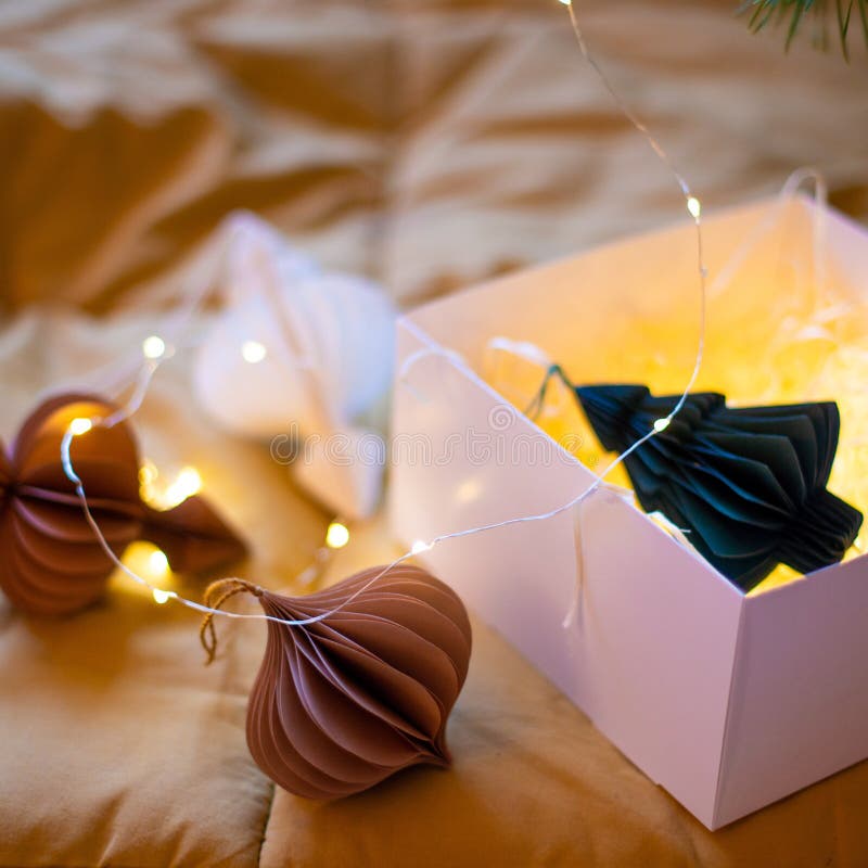 Stylish paper Christmas tree toys in Scandinavian style on fir branches. A banner for the design of web pages. royalty free stock photo