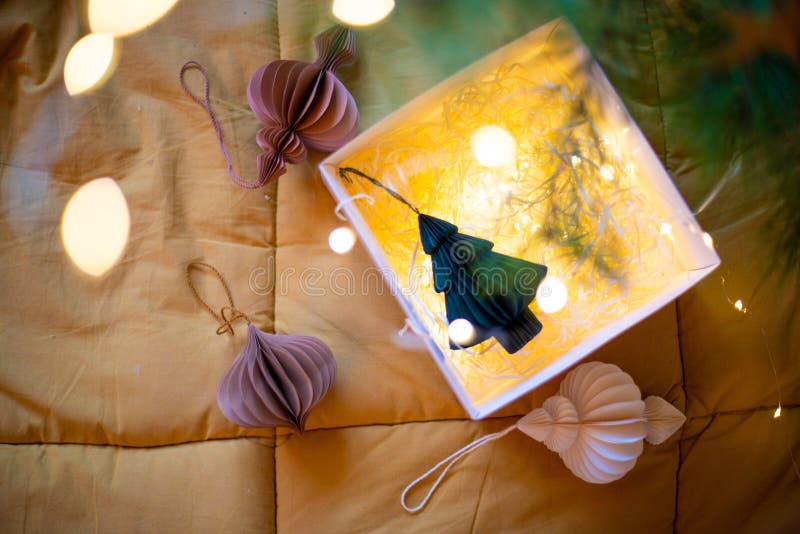 Stylish paper Christmas tree toys in Scandinavian style on fir branches. A banner for the design of web pages. The concept of a stylish new year and Christmas 2025