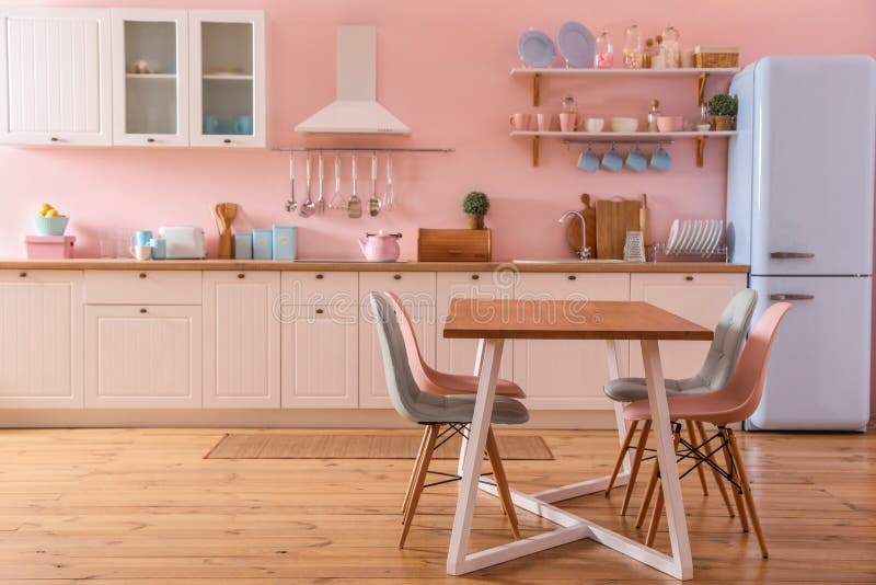 Stylish Pink Kitchen Interior with Table and Chairs Stock Image Image