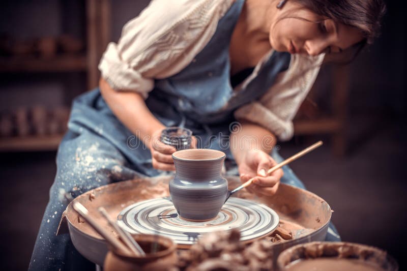 Stylish Pottery Woman Siting on Bench with Pottery Wheel and Making Clay  Pot. National Craft. Stock Photo - Image of handicrft, shape: 147147962
